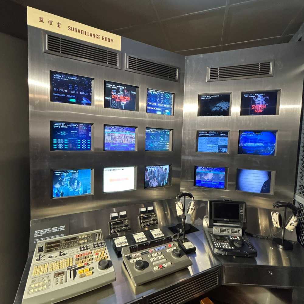 Surveillance Room recreates scenes of police monitoring citywide CCTV footage, with views into the identification parade room.